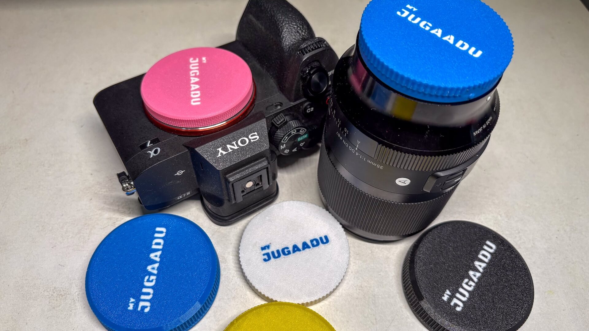 Custom 3D Printed Lens Cap — colourful lens caps on Sony camera